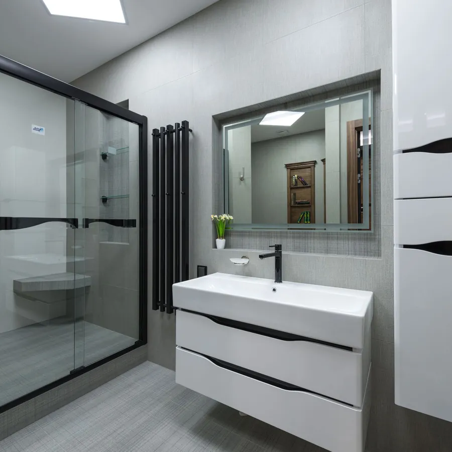 Newly fitted white bathroom with a walk-in shower